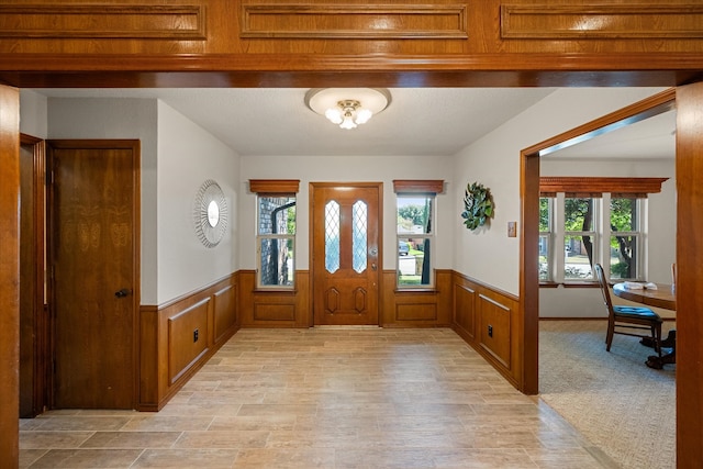 foyer featuring plenty of natural light