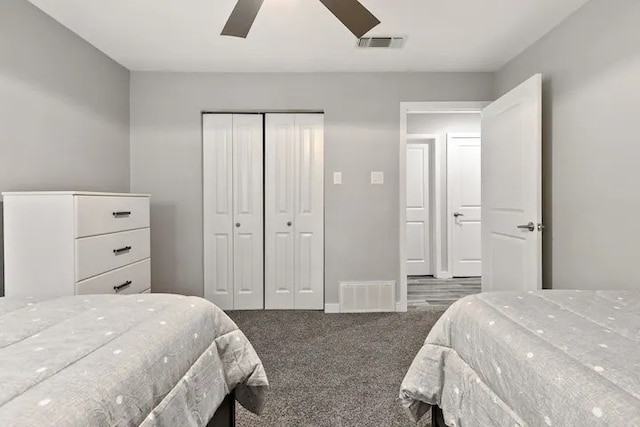 carpeted bedroom featuring ceiling fan and a closet