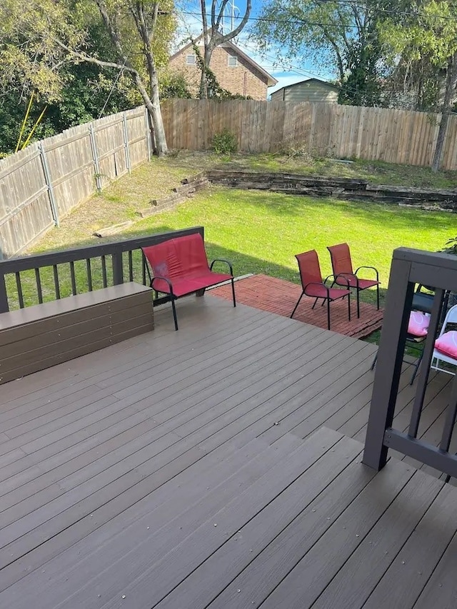 deck featuring a lawn