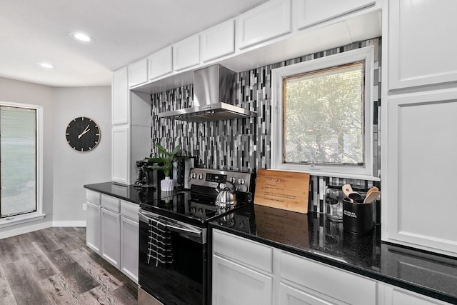 2030 Klondike St, Grand Prairie, TX 75050 - kitchen featuring electric range, wall chimney range hood, tasteful backsplash, white cabinets, and recessed lighting