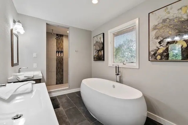 bathroom with vanity and independent shower and bath