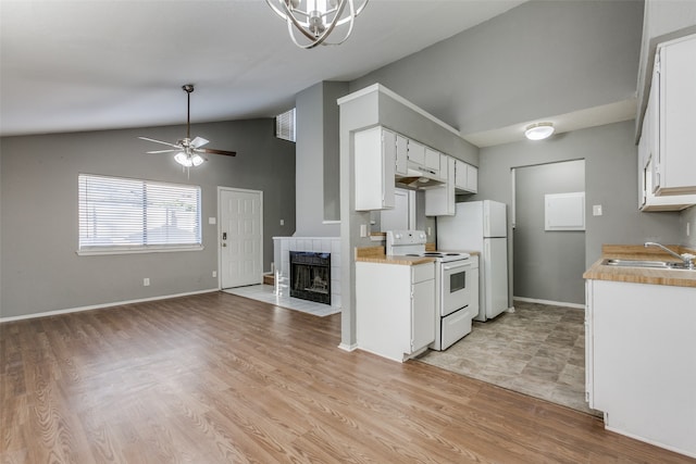 kitchen featuring white cabinetry, sink, white appliances, and light wood-type flooring