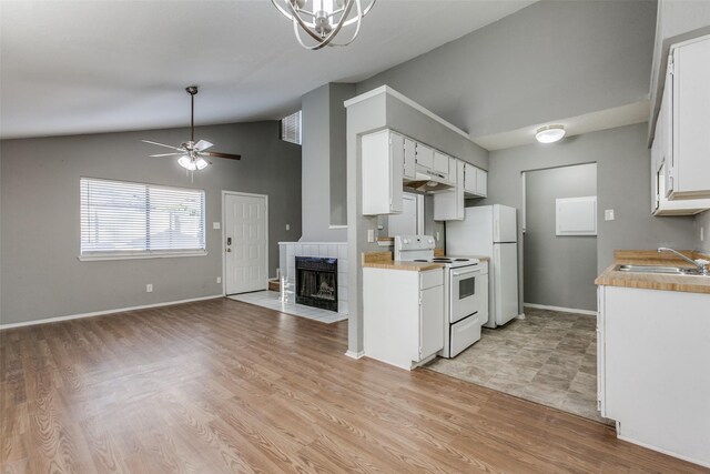 2240 Tarpley Rd Unit 462, Carrollton, TX 75006 - kitchen featuring white appliances, vaulted ceiling, a ceiling fan, light countertops, and white cabinets