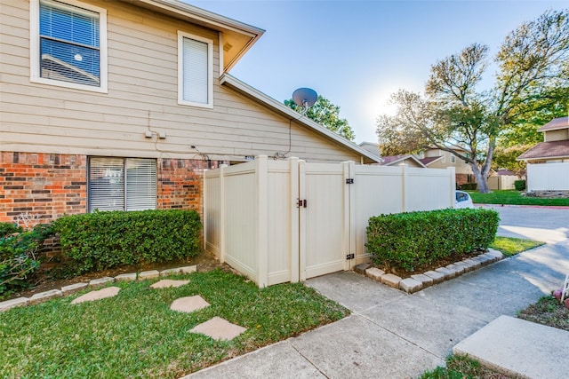 2240 Tarpley Rd Unit 462, Carrollton, TX 75006 - view of home's exterior with a gate