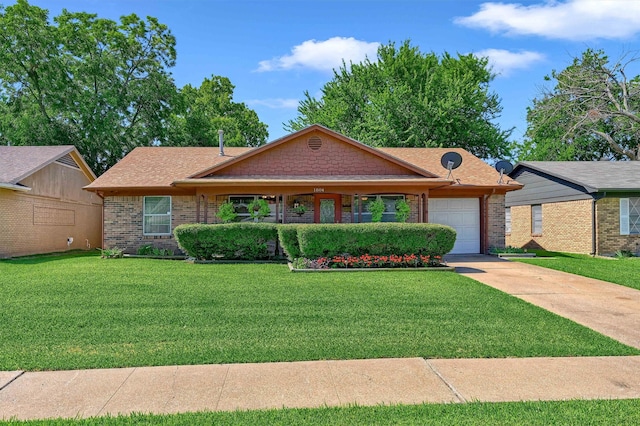 single story home with a front yard and a garage