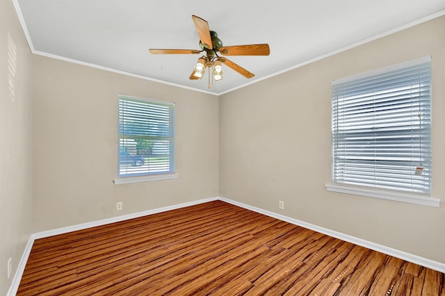 unfurnished room featuring ceiling fan, crown molding, and hardwood / wood-style flooring