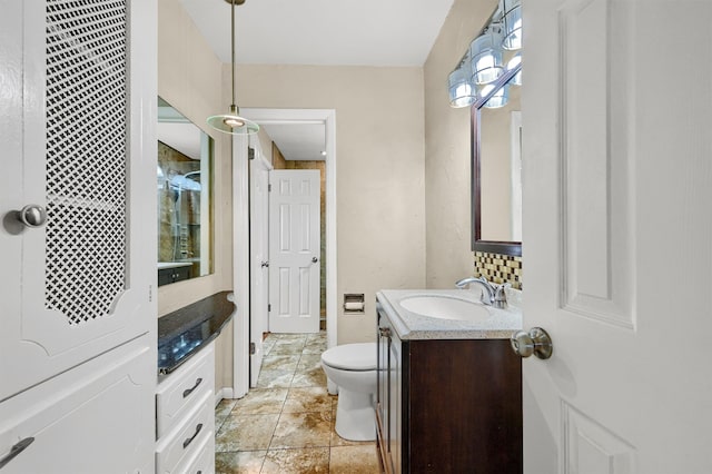 bathroom with tile patterned floors, vanity, and toilet