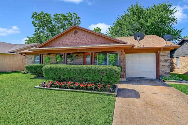 ranch-style home with a garage and a front lawn