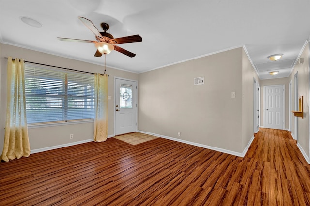 foyer with light hardwood / wood-style flooring, ceiling fan, and crown molding