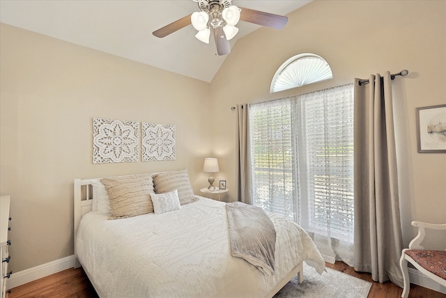 bedroom with hardwood / wood-style floors, ceiling fan, and lofted ceiling