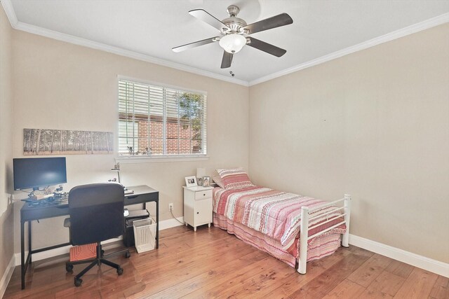 bedroom with ceiling fan, wood-type flooring, and crown molding