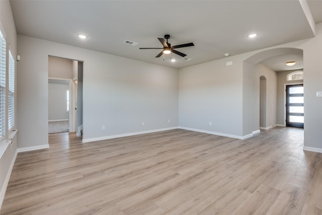 spare room featuring light wood-type flooring and ceiling fan