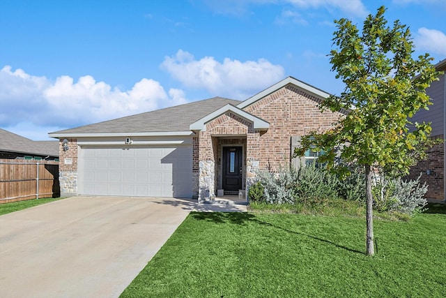 view of front of house with a front yard and a garage