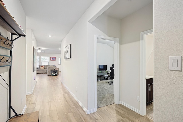 hall with light wood-type flooring