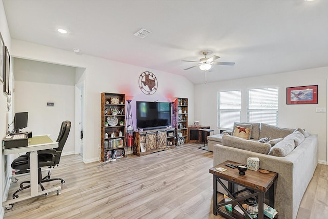 living room featuring ceiling fan and light hardwood / wood-style floors