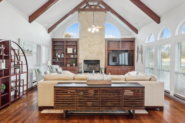 living room featuring plenty of natural light, high vaulted ceiling, and dark hardwood / wood-style floors