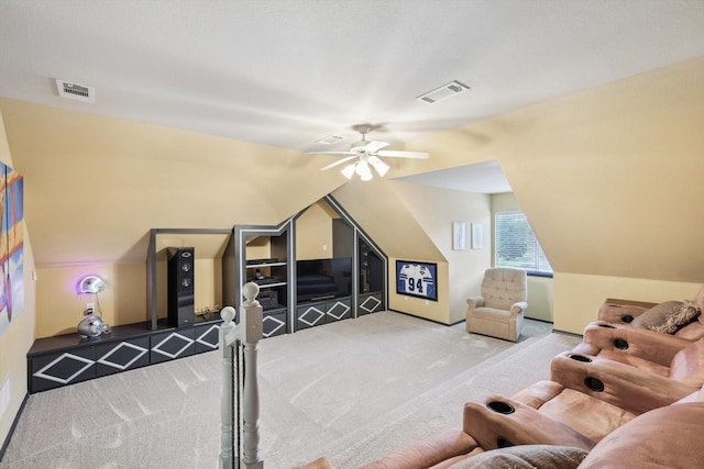 carpeted bedroom with ceiling fan and vaulted ceiling