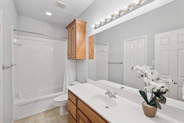 full bathroom with tile patterned flooring, vanity, toilet, and shower / bath combo with shower curtain