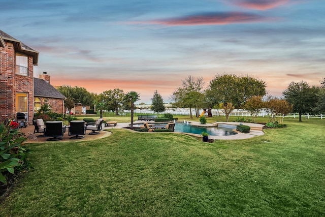 yard at dusk with a patio