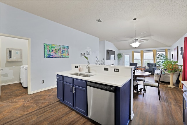 kitchen featuring stainless steel dishwasher, vaulted ceiling, a kitchen island with sink, sink, and dark hardwood / wood-style floors