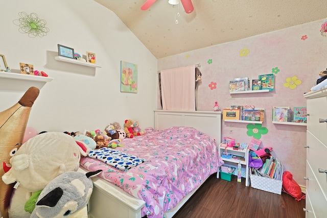 bedroom featuring ceiling fan, dark wood-type flooring, and lofted ceiling