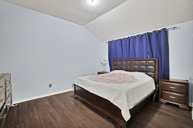 bedroom featuring vaulted ceiling, a textured ceiling, and dark hardwood / wood-style floors