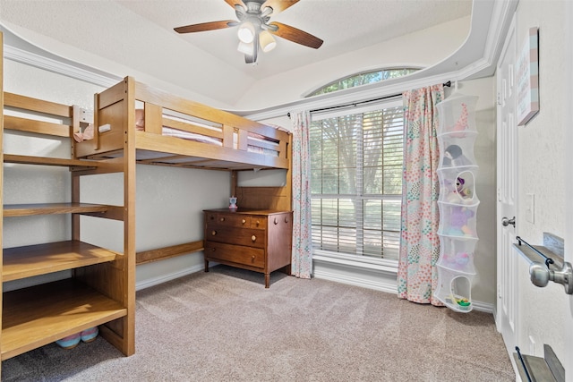 carpeted bedroom with a textured ceiling and ceiling fan