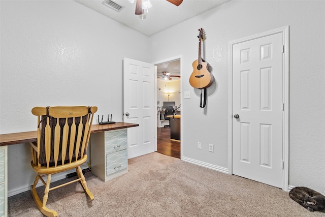 office featuring carpet and a textured ceiling