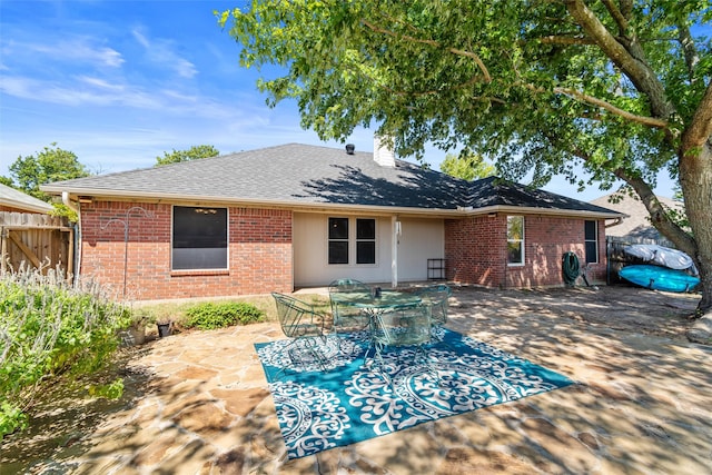 back of house with a patio