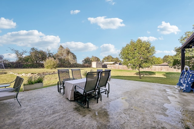 view of patio featuring a storage unit