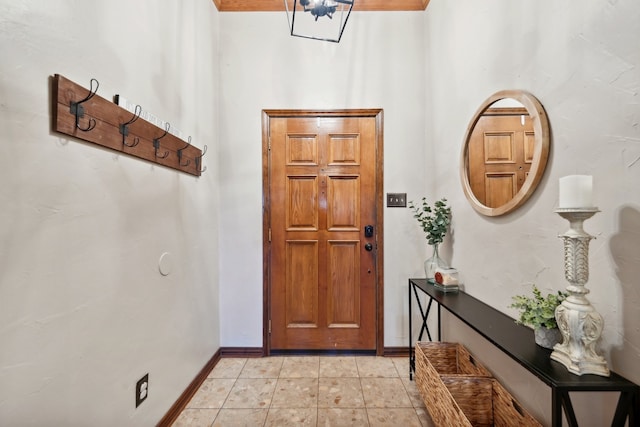 entryway with an inviting chandelier