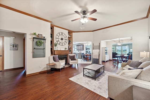 living room featuring ceiling fan with notable chandelier, dark hardwood / wood-style floors, and ornamental molding