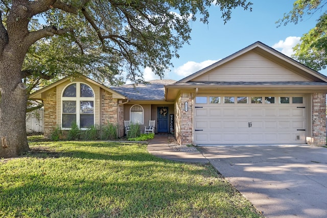 single story home featuring a front yard and a garage