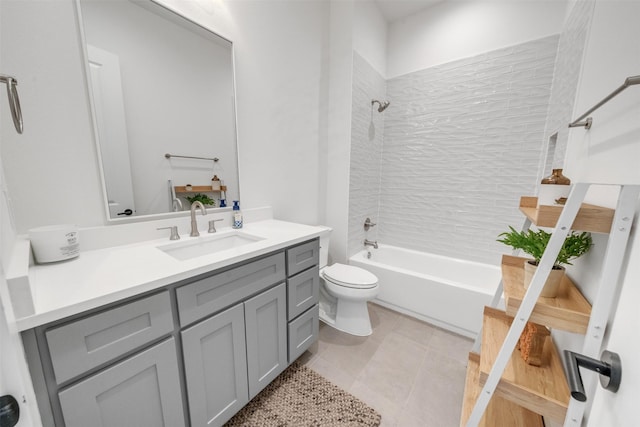 full bathroom with tile patterned floors, vanity, toilet, and tiled shower / bath