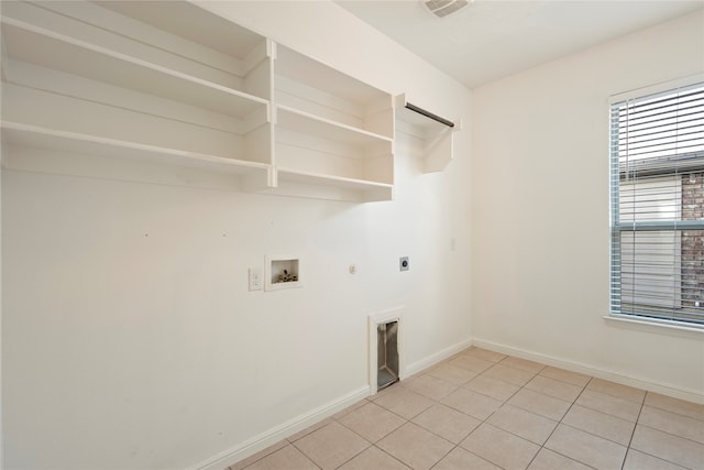 laundry room with electric dryer hookup, hookup for a gas dryer, light tile patterned flooring, and washer hookup