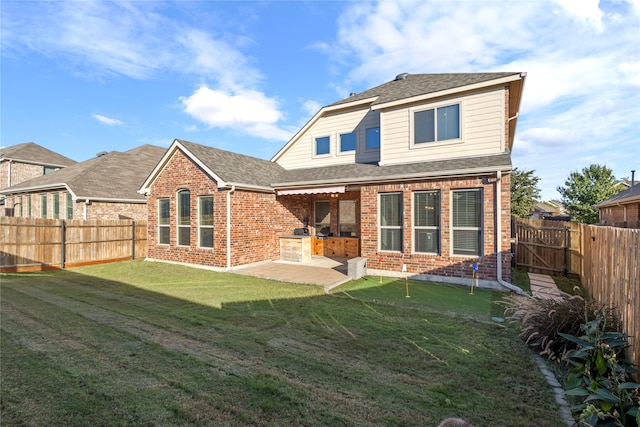 rear view of property featuring a patio and area for grilling