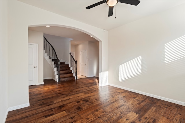 unfurnished room featuring dark hardwood / wood-style flooring and ceiling fan