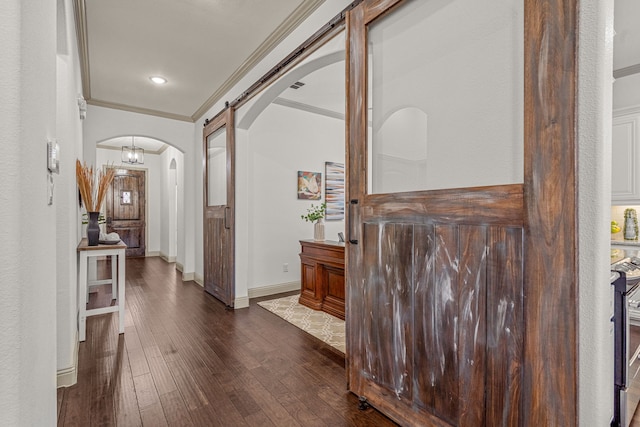 hallway with dark hardwood / wood-style flooring and ornamental molding