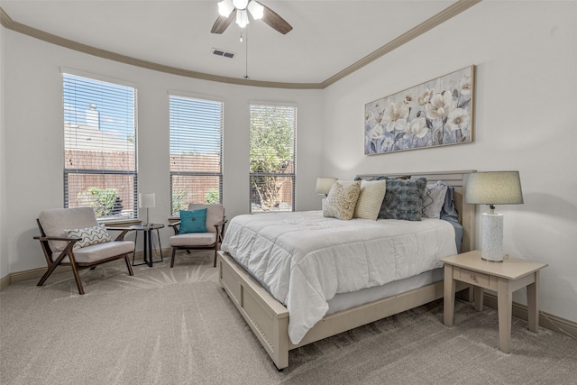 bedroom with ceiling fan, light colored carpet, and ornamental molding