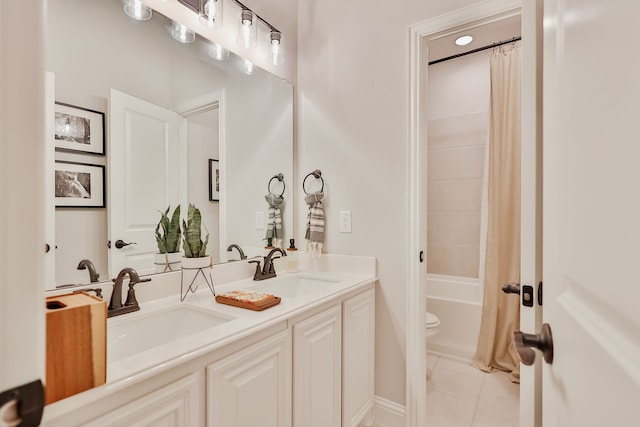 full bathroom featuring tile patterned flooring, vanity, toilet, and shower / tub combo with curtain