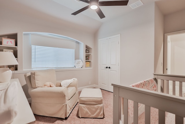 carpeted bedroom featuring ceiling fan, a closet, and vaulted ceiling