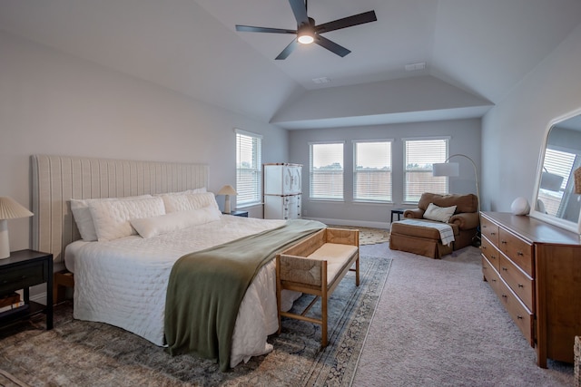 carpeted bedroom with ceiling fan, lofted ceiling, and multiple windows