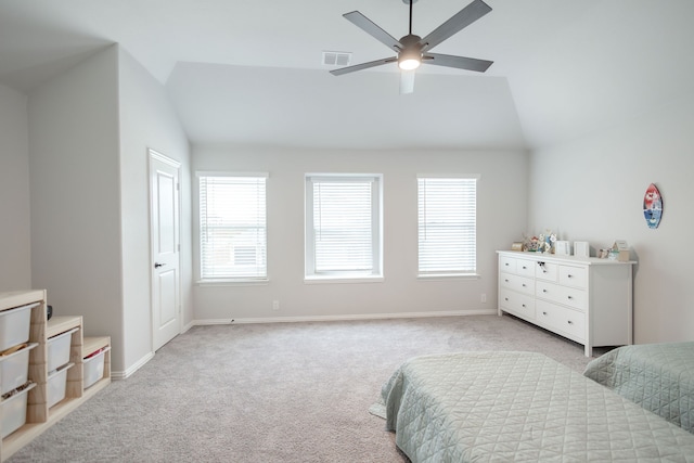 bedroom featuring ceiling fan, light colored carpet, and lofted ceiling