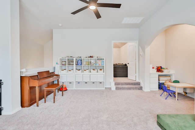 misc room featuring light carpet, ceiling fan, and lofted ceiling