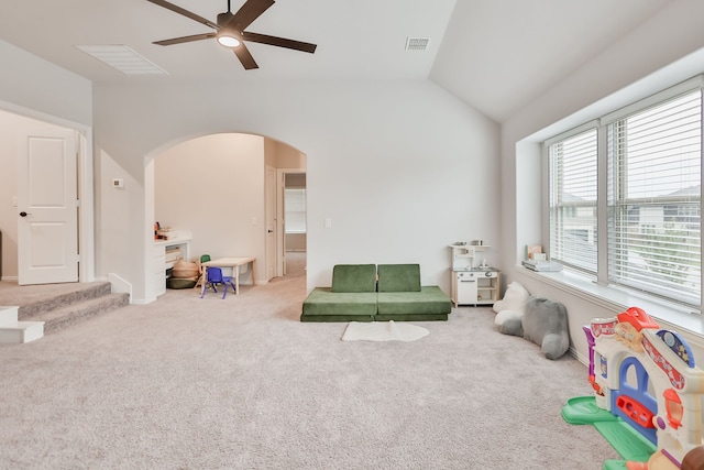 rec room with ceiling fan, lofted ceiling, and carpet floors