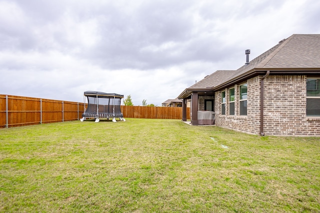 view of yard featuring a trampoline