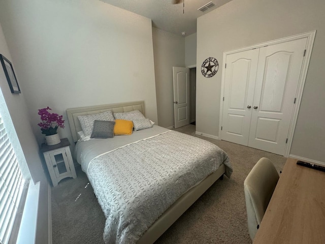 bedroom with carpet flooring and a closet