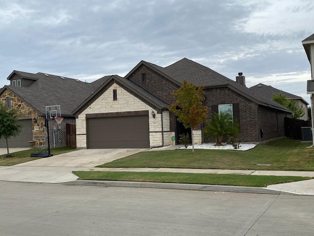 view of front facade with a front yard and a garage