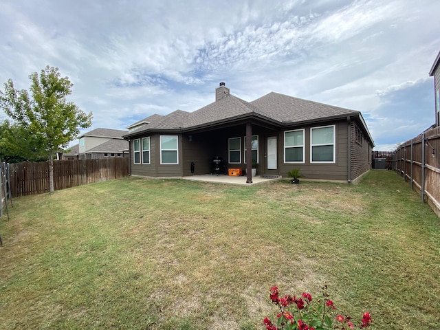 back of house with a lawn, a patio area, and central air condition unit