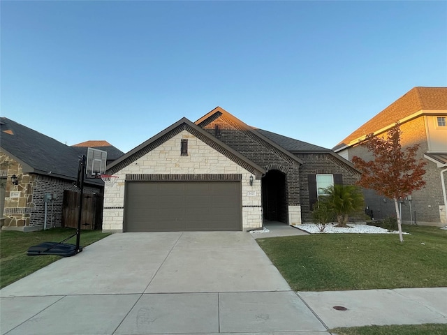 view of front of house with a garage and a front yard